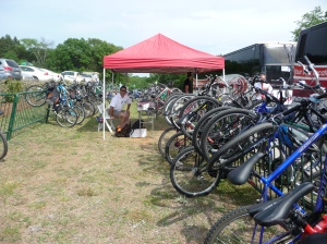 CABA volunteer Jeff Viscount surrounded by bikes at Quail Hollow 